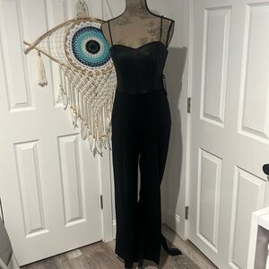 Black BEBE size medium strappy mix media romper